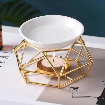 Elegant gold aromatherapy oil burner with a unique hollow-out design, creating a soothing and sophisticated ambiance in a living space