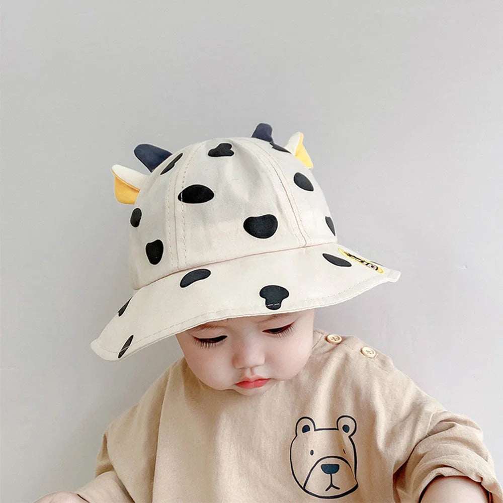 Adorable cow-patterned kids' bucket hat made of soft, breathable cotton for comfortable outdoor wear