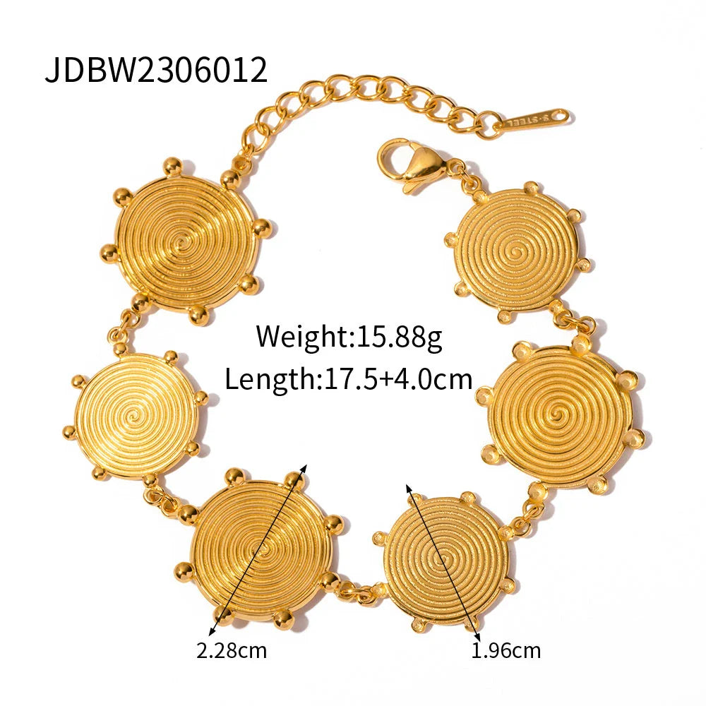Close-up of a luxurious 18K gold plated stainless steel bracelet with an elegant palace-style design