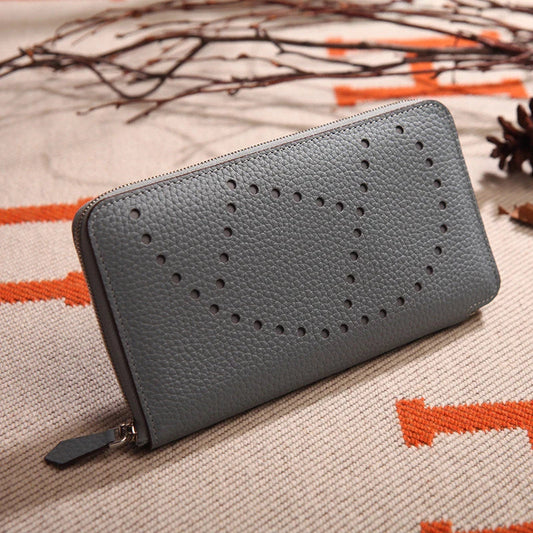 Lychee-patterned premium cowhide leather clutch bag in a sleek, square silhouette