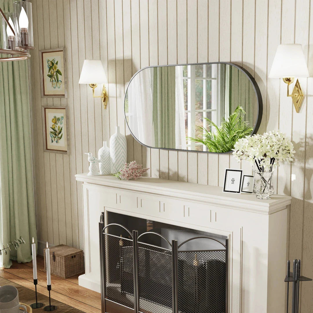 Elegant black oval-shaped wall mirror with a modern and sophisticated design, perfect for bathroom, entryway, and living room decor.