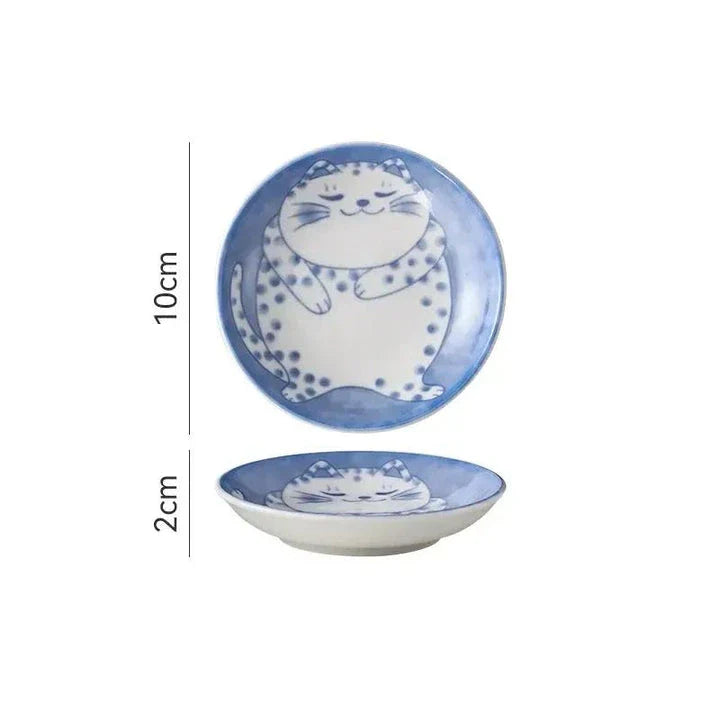 Charming Japanese ceramic sauce dish with a lucky cat design, perfect for serving sauces, sushi, and more.