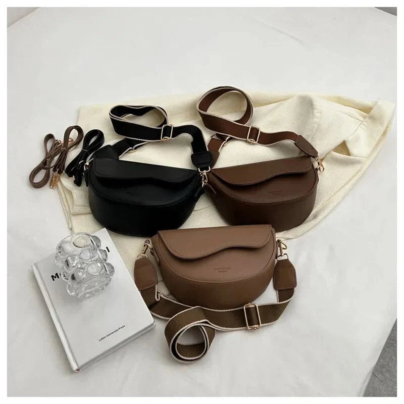 A stylish pillow-shaped shoulder bag made of high-quality PU leather, featuring a crossbody and messenger design for versatile use.