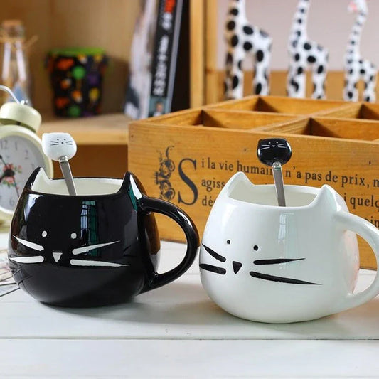 Charming black cat-shaped ceramic coffee mug with a spoon, a practical and whimsical addition to any coffee lover's collection