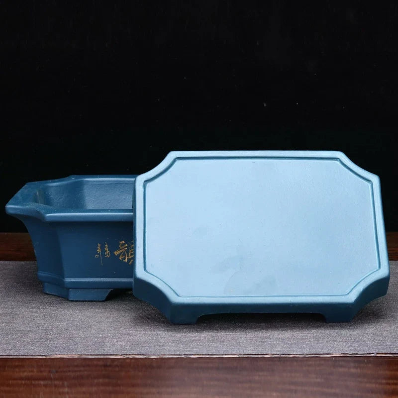 Elegant ceramic bonsai planter in red and dark green colours, with a refined antique-inspired design suitable for desktop or indoor use