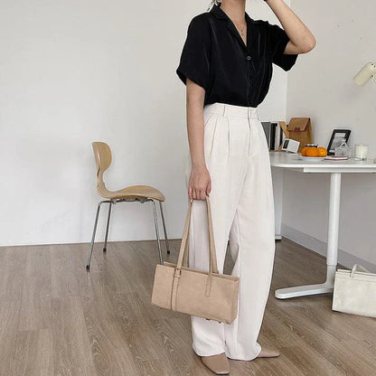 A premium polyester tote bag in a variety of colours, featuring a stylish Japanese and Korean-inspired design for the modern British shopper.
