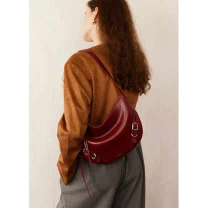 Elegant leather shoulder and crossbody bag for women, featuring a spacious main compartment, interior zip pocket, and contemporary design
