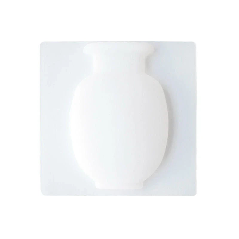 Elegant silicone suction wall vase in pink, designed to hold various plant sizes and fit seamlessly in modern homes