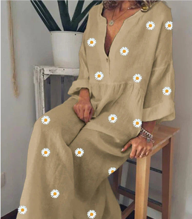 A stylish and comfortable loose dress featuring a charming daisy print and long sleeves, perfect for various occasions.
