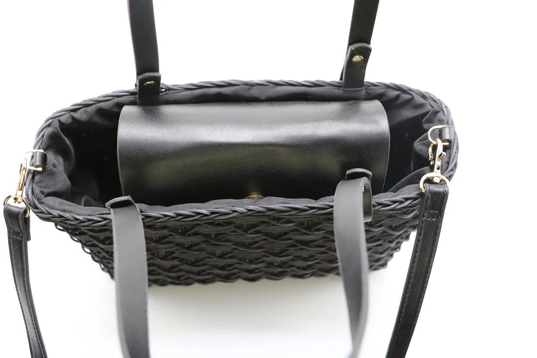 Handwoven rattan handbag in black with a sleek, elegant design for effortless style and practicality