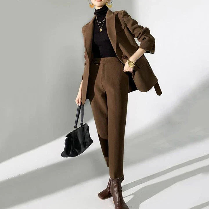 Elegant wool pant suits for women featuring a high-waist design, raglan sleeves, and modern 'hip hop' style trousers in a solid black colour