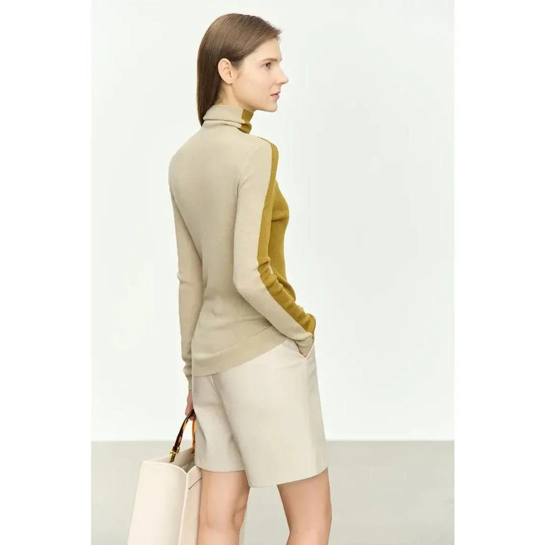A cosy and stylish turtleneck sweater with a unique patchwork design, made from a premium wool blend for exceptional comfort and elegance.