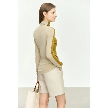 A cosy and stylish turtleneck sweater with a unique patchwork design, made from a premium wool blend for exceptional comfort and elegance.