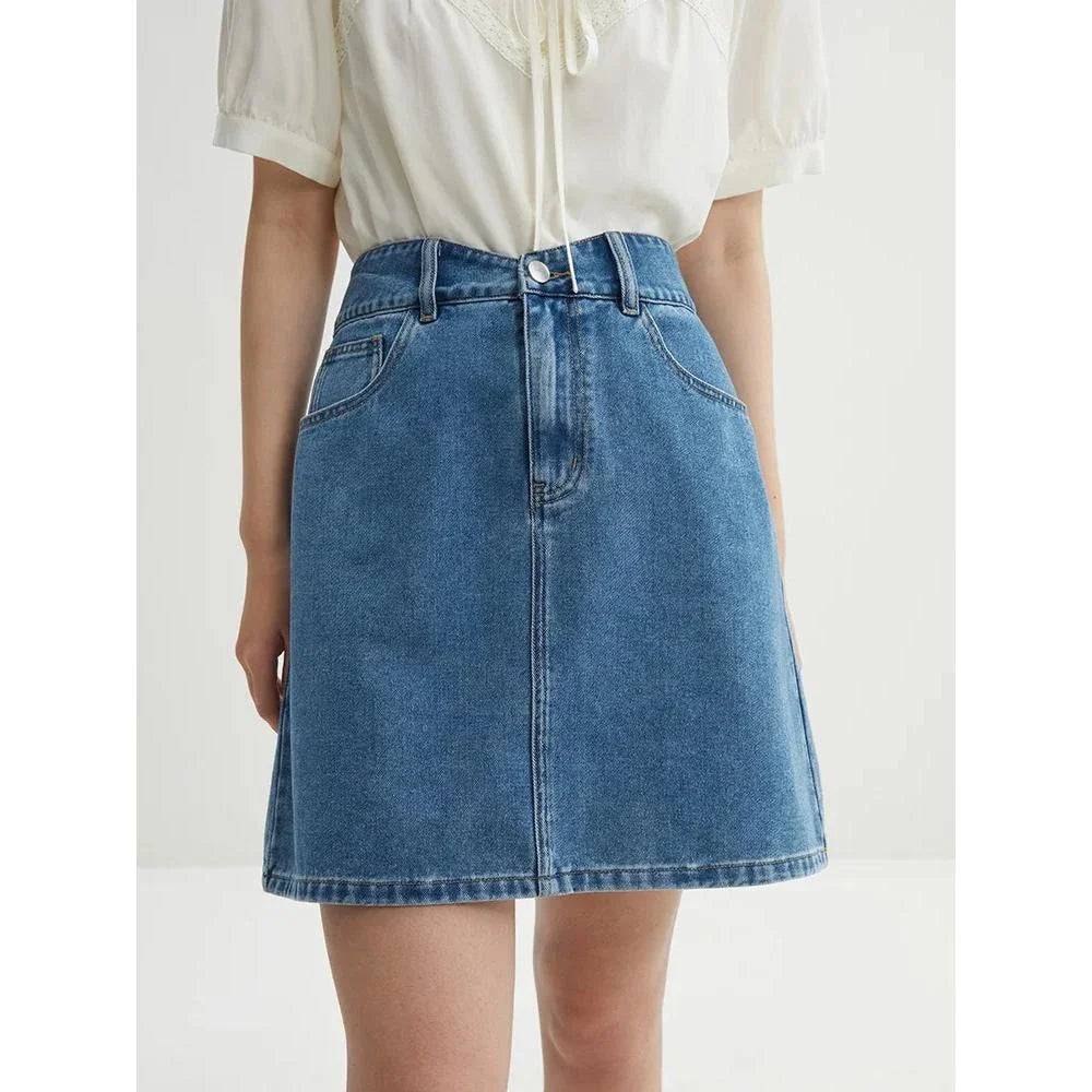 Chic high-waisted denim skirt in a classic blue shade, featuring an A-line silhouette and a flattering empire waistline.
