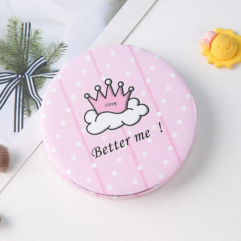 Compact portable foldable makeup mirror with cute cartoon prints for on-the-go beauty touch-ups