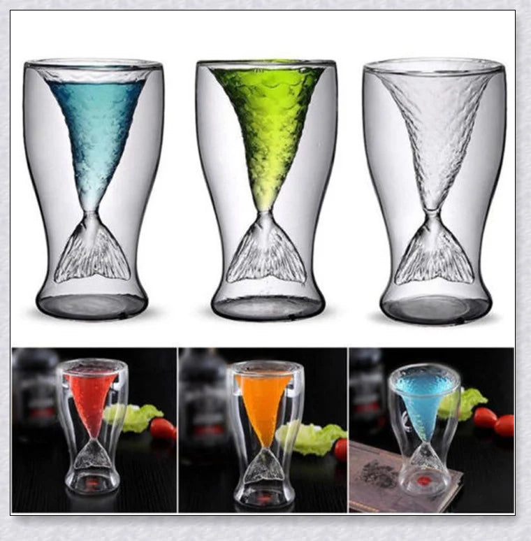 A transparent glass mug with a decorative mermaid tail design, perfect for enjoying a range of beverages in style.
