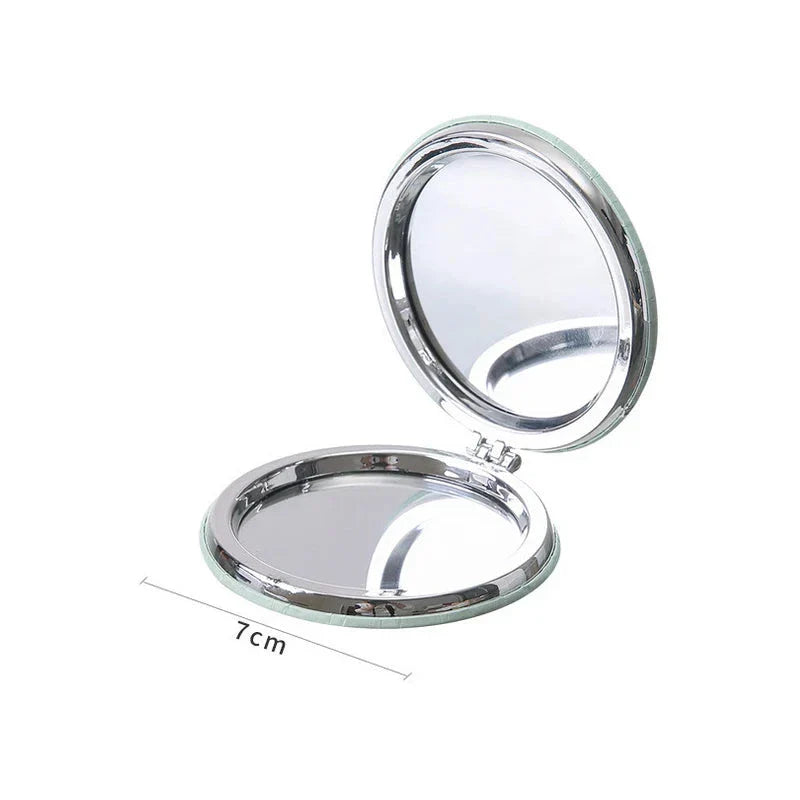 Compact portable foldable makeup mirror with cute cartoon prints for on-the-go beauty touch-ups