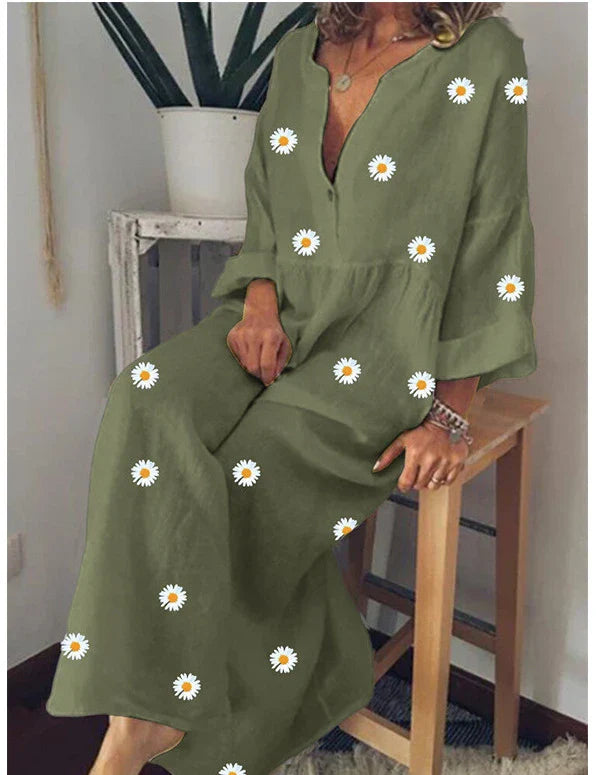 A stylish and comfortable loose dress featuring a charming daisy print and long sleeves, perfect for various occasions.