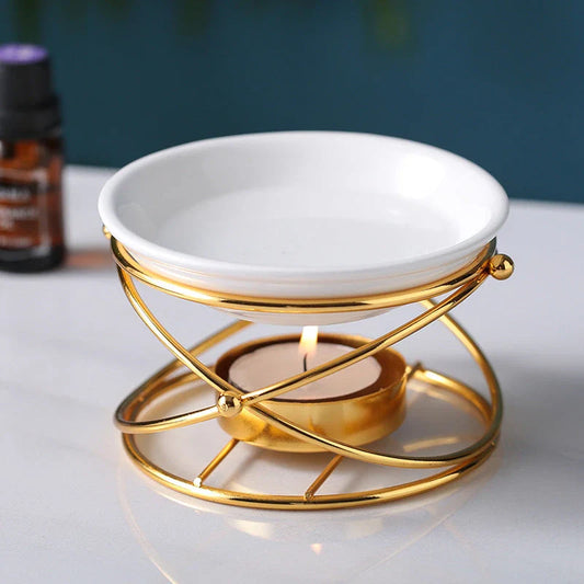 Elegant gold aromatherapy oil burner with a unique hollow-out design, creating a soothing and sophisticated ambiance in a living space