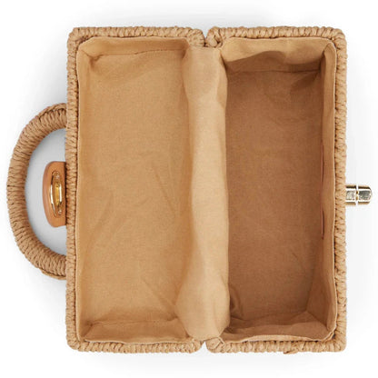 Handcrafted natural straw beach bag with bohemian-inspired design and detachable metal chain strap