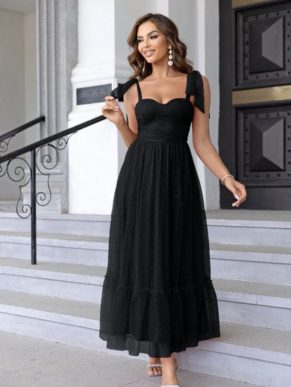 Enchanting fairy-style dress with flowing silhouette, delicate lace accents, and mid-length skirt in a classic black colour