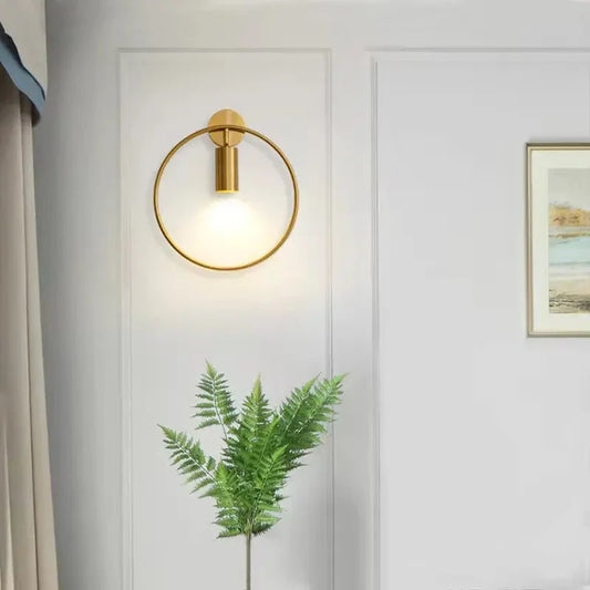 Elegant Nordic-style LED bedside wall lamp with gold finish, providing warm and energy-efficient lighting for modern living spaces