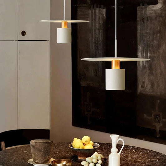 A modern and elegant minimalist pendant light made of durable metal with a smooth painted finish, providing focused and cosy illumination for a variety of interior spaces.