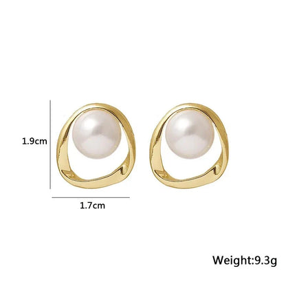 Elegant gold-coloured simulated pearl stud earrings with a distinctive geometric design