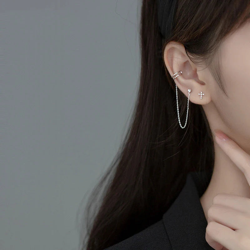 Asymmetric sterling silver one-piece earring and ear clip set with a modern and distinctive design