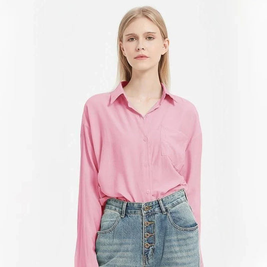 A classic long-sleeve button-up blouse in a range of chic colours, offering timeless elegance and modern sophistication for the fashion-conscious woman.
