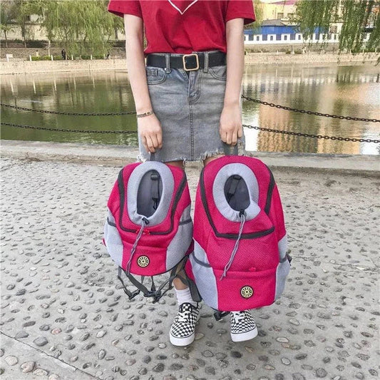 Compact dog carrier backpack made of durable nylon with a convenient front hole for small dogs to poke their head out