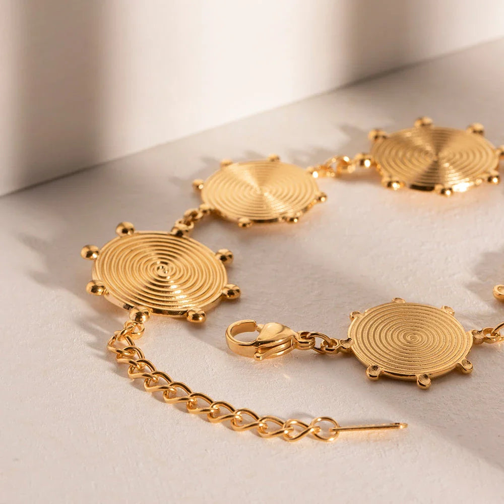 Close-up of a luxurious 18K gold plated stainless steel bracelet with an elegant palace-style design