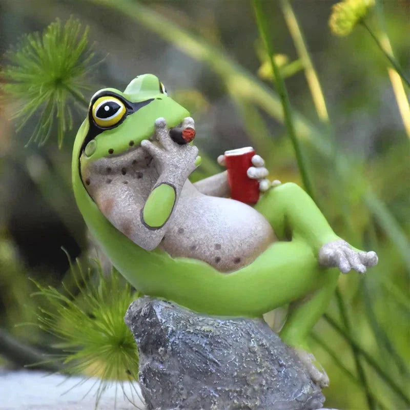 Charming frog garden figurines in various mischievous poses, adding a playful touch to outdoor decor