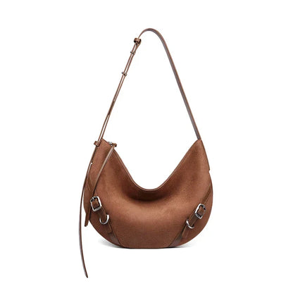 Elegant leather shoulder and crossbody bag for women, featuring a spacious main compartment, interior zip pocket, and contemporary design