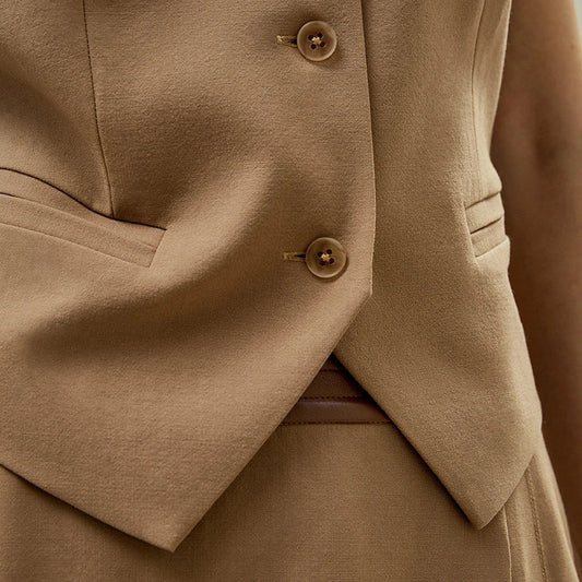 A refined silk-wool blend sleeveless vest with a smart collared V-neckline and single-breasted closure, offering versatile style and comfort.