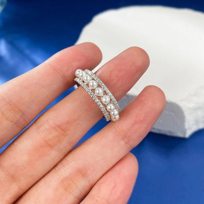 A beautiful 925 sterling silver ring with a delicate pearl accent, designed for the discerning British woman