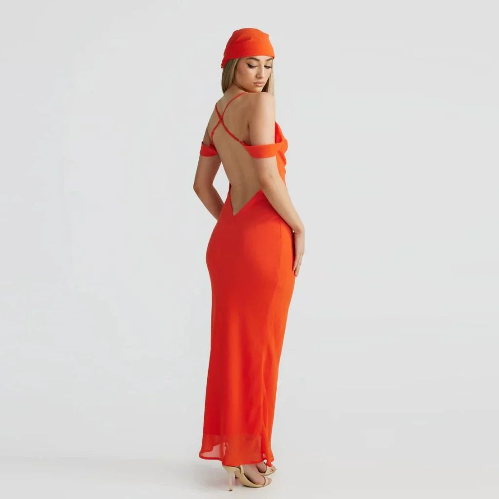 Elegant off-shoulder maxi dress in orange colour, featuring a halter backless design and pile collar neckline for a sophisticated look.