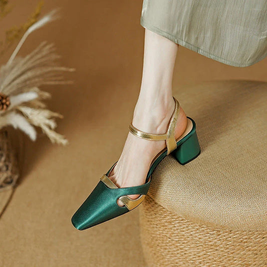 Elegant green high heel sandals with ankle strap, showcasing a sophisticated square heel design and premium materials