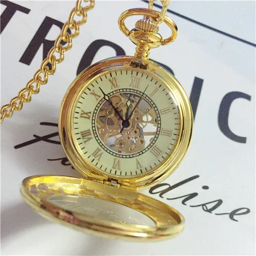 Elegant mechanical pocket watch with a golden pattern, showcasing British craftsmanship and timeless style.