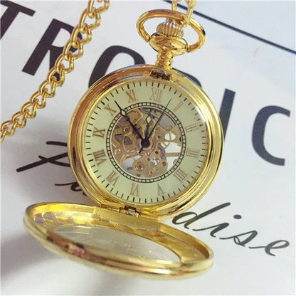 Elegant mechanical pocket watch with a golden pattern, showcasing British craftsmanship and timeless style.