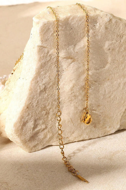 Elegant 18K gold-plated pearl hoop necklace with a lustrous synthetic pearl centrepiece