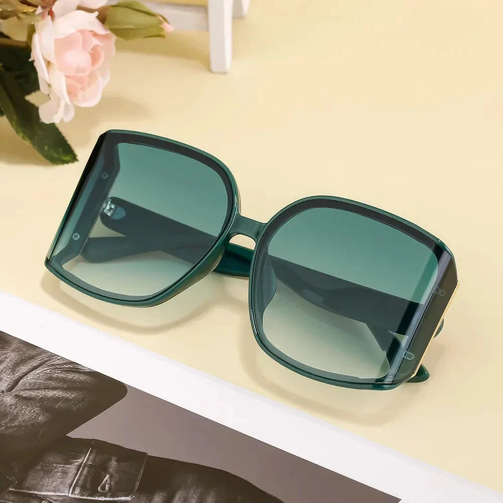 Chic and oversized square sunglasses with gradient lenses, providing UV protection and a stylish look for women
