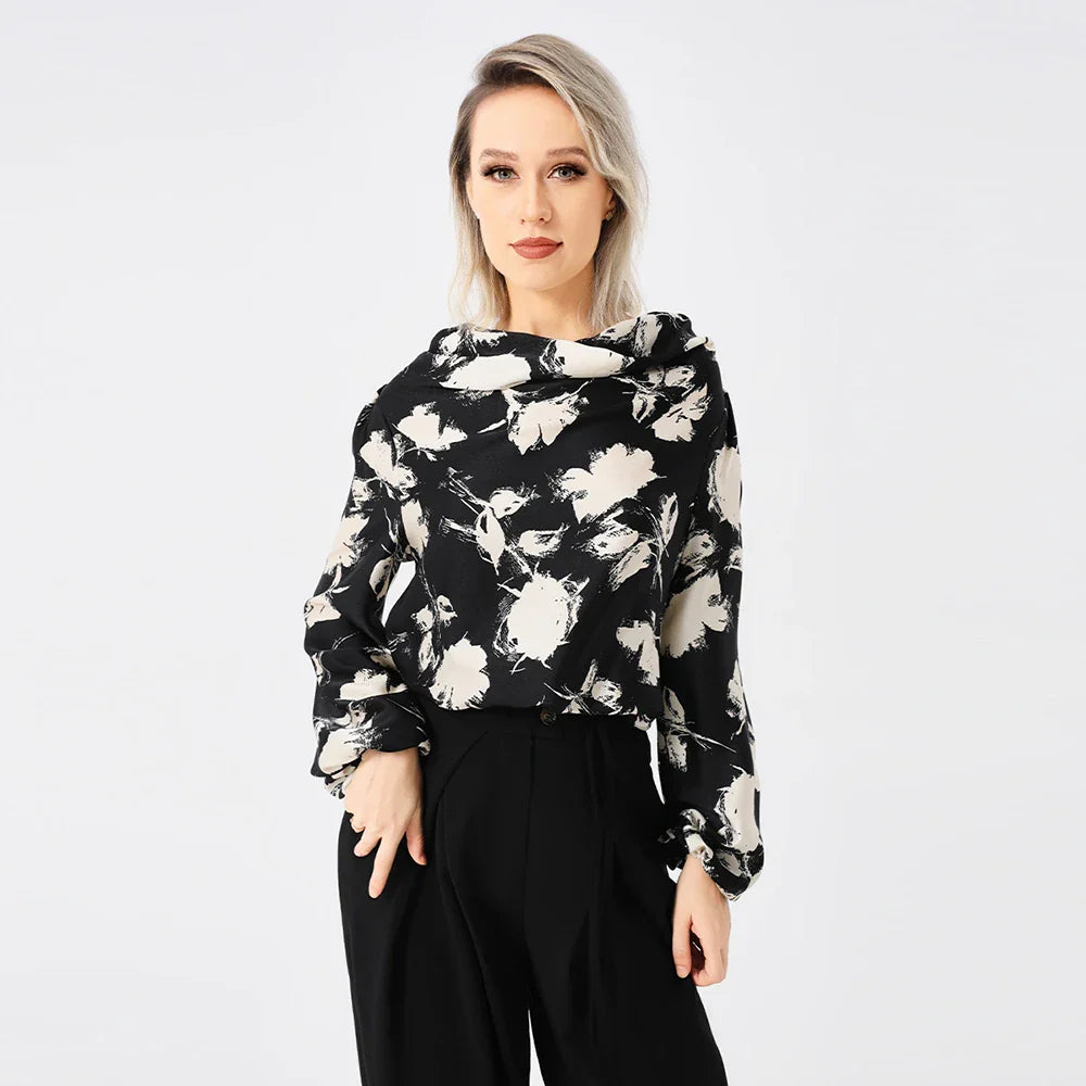 Elegant ladies' blouse with a printed pattern, dropped collar, and long sleeves in a classic white colour