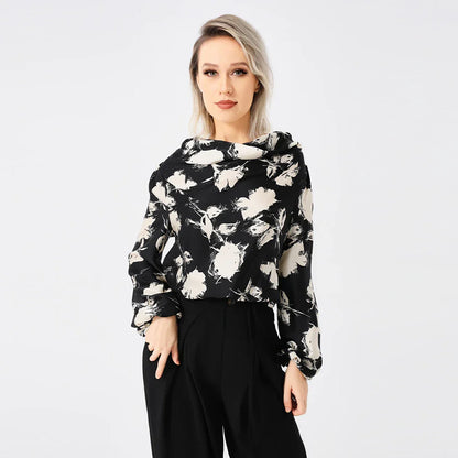 Elegant ladies' blouse with a printed pattern, dropped collar, and long sleeves in a classic white colour