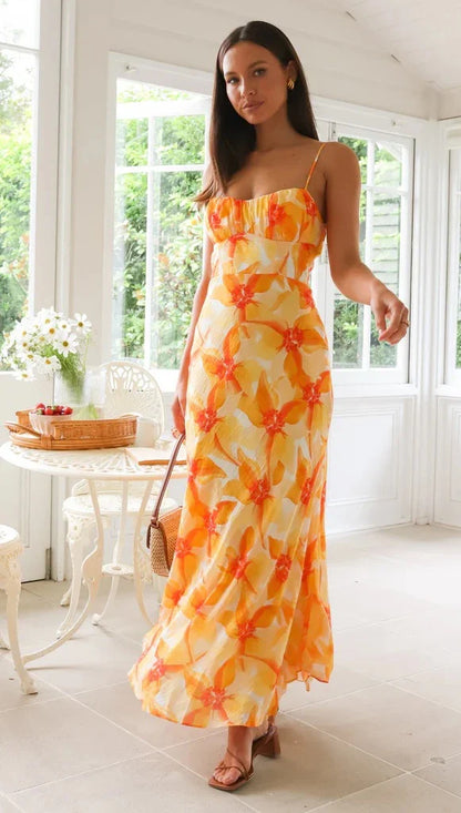 Elegant floral midi dress with backless design, available in yellow, purple, and green colours
