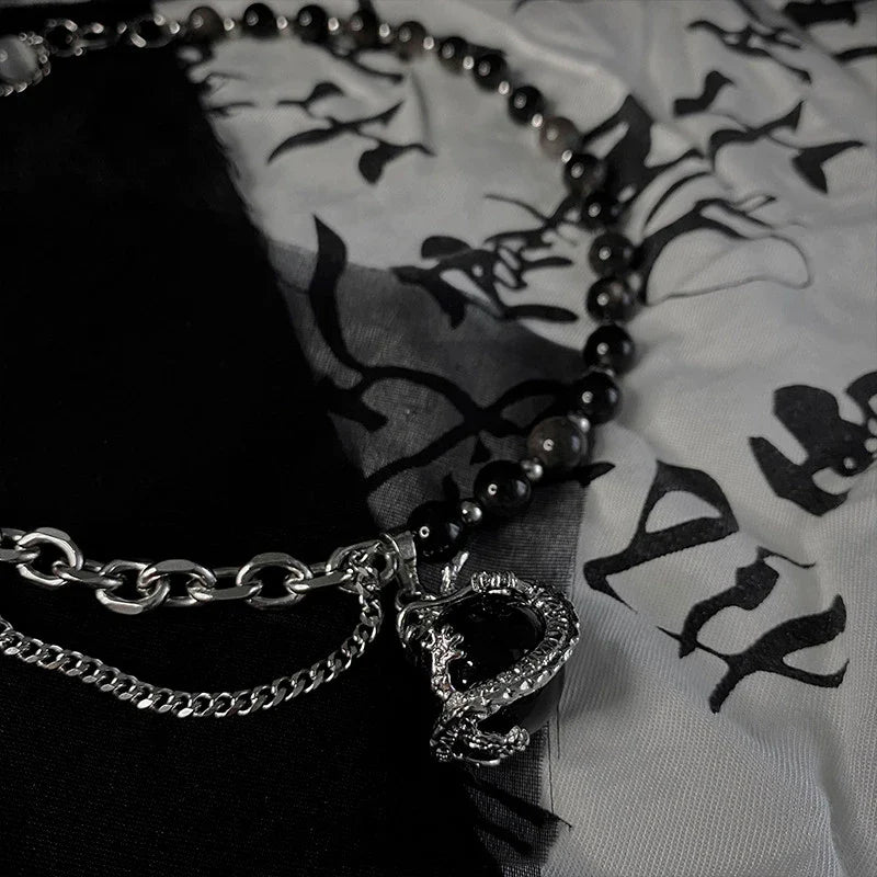 Black agate dragon pendant necklace made of titanium steel with adjustable chain and elegant design