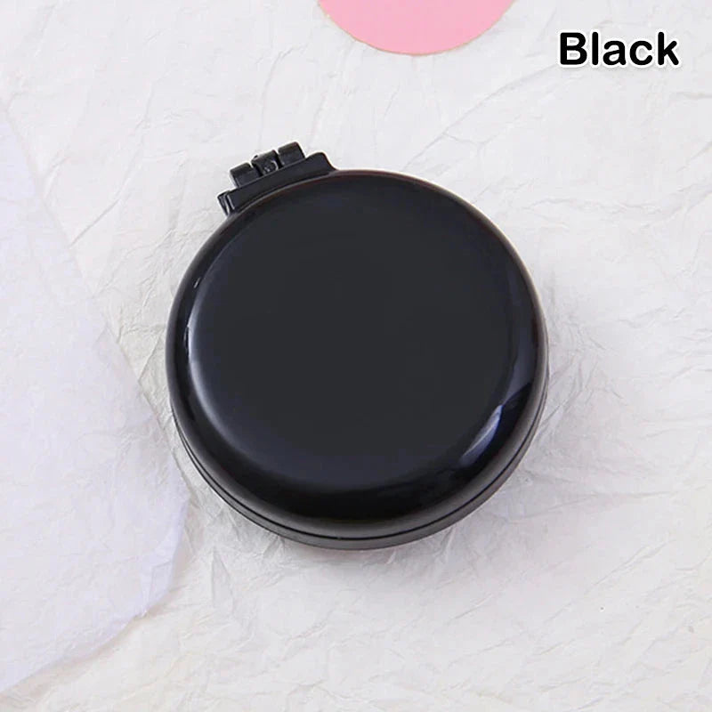 Portable folding hair comb with mirror, featuring a dual-sided design with a round mirror and eco-friendly hairbrush for on-the-go styling and grooming