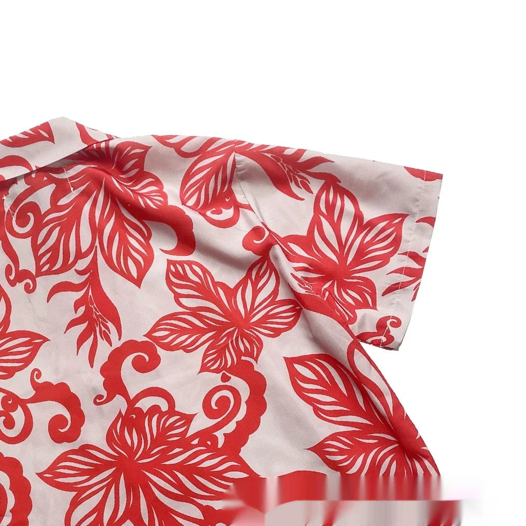 A stylish red short-sleeve shirt with a retro vine print pattern, perfect for casual British-inspired fashion.