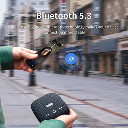 Portable Bluetooth speaker with powerful bass, IP67 waterproof rating, built-in power bank, and 12-hour battery life