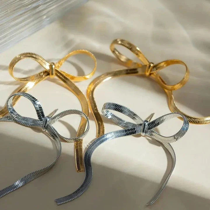 18K gold plated bowknot snake bone chain necklace with a sleek, elegant design